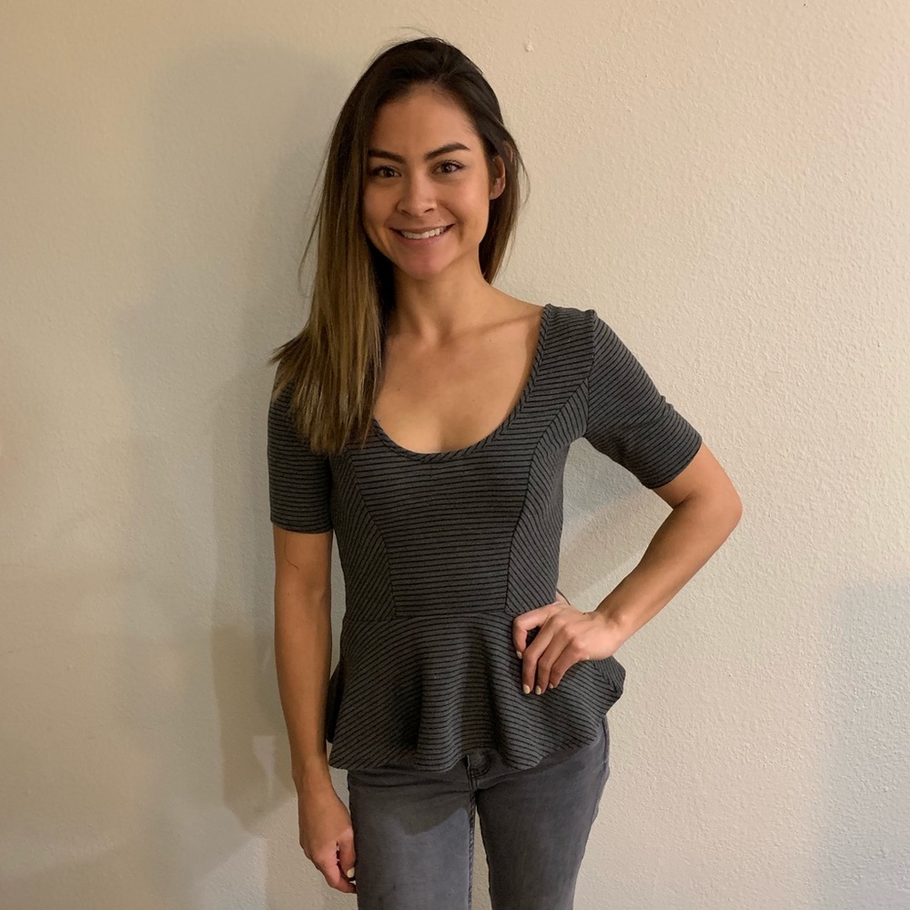 A peplum grey striped shirt